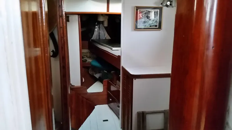 Slide: The Image of Interior of 1960 Frans Maas-LeFevre One Off Custom 47 sailboat, featuring wooden finishes. - 14