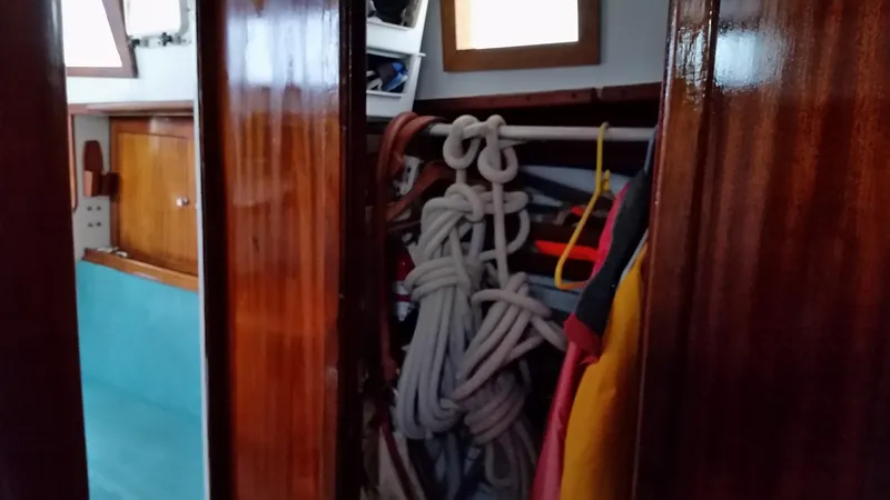 Slide: The Image of Interior of 1960 Frans Maas-LeFevre One Off Custom 47 sailboat with ropes and wooden finish. - 18