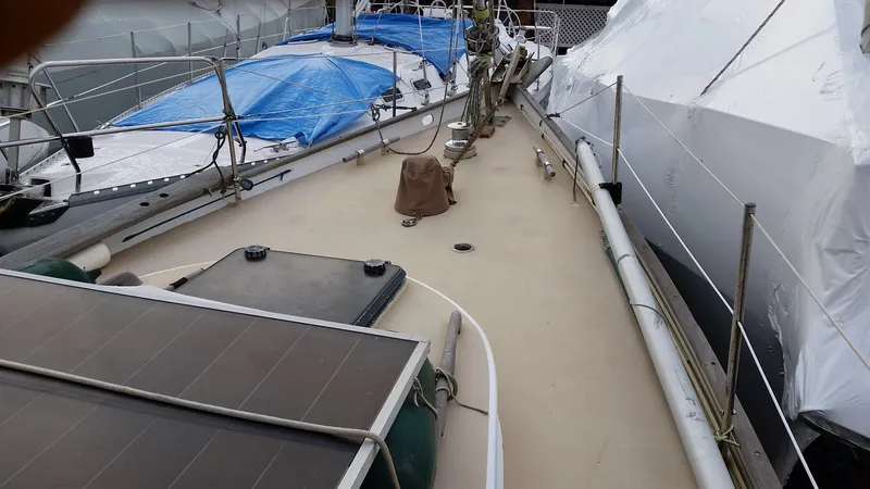 Slide: The Image of 1960 Frans Maas-LeFevre One Off Custom 47 sailboat deck with solar panels and covered equipment. - 20