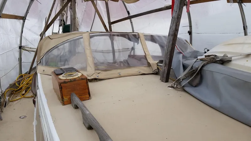 Slide: The Image of 1960 Frans Maas-LeFevre One Off Custom 47 sailboat under cover, showcasing deck and cockpit. - 24