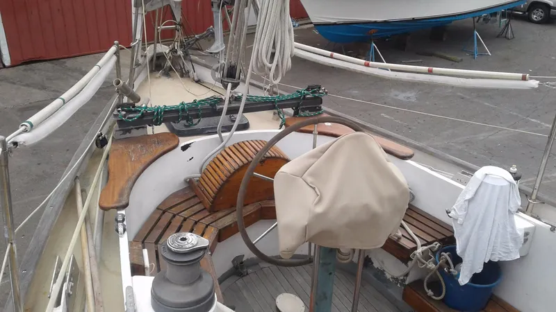 Slide: The Image of 1960 Frans Maas-LeFevre One Off Custom 47 sailboat cockpit with wooden benches and steering wheel. - 28