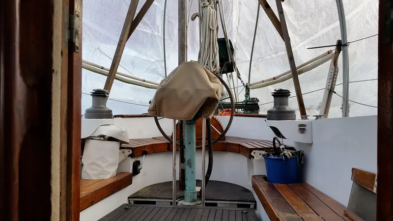 Slide: The Image of Interior view of 1960 Frans Maas-LeFevre One Off Custom 47 sailboat, featuring wooden benches and equipment. - 29