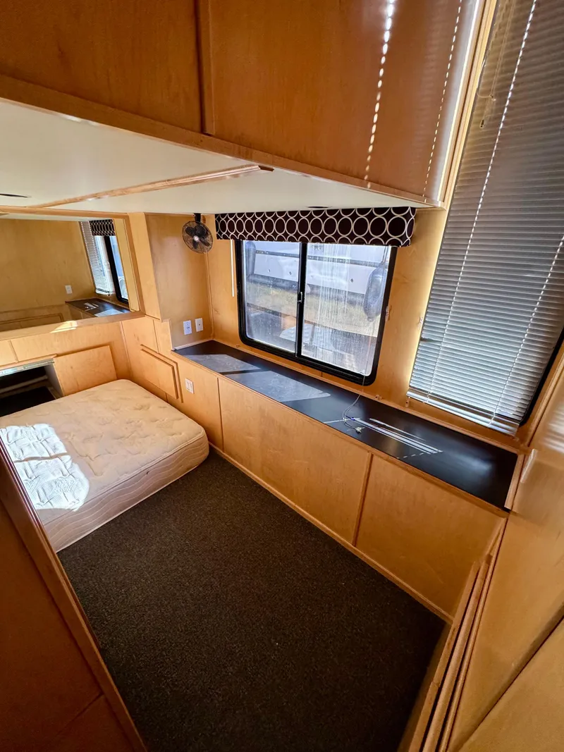 Slide: The Image of Interior of 2006 Sumerset Seas The Day Trip 11, featuring a cozy bedroom with large windows. - 14