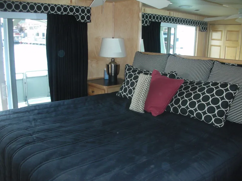 Slide: The Image of Sumerset Seas The Day Trip 11 2006 bedroom with stylish decor and large windows. - 2