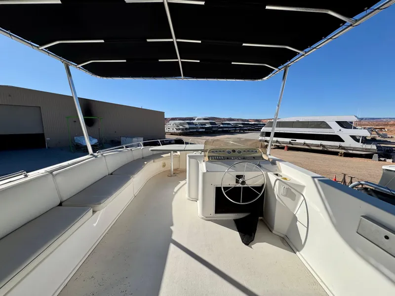 Slide: The Image of 2006 Sumerset Seas The Day Trip 11 boat interior with canopy and steering wheel. - 29