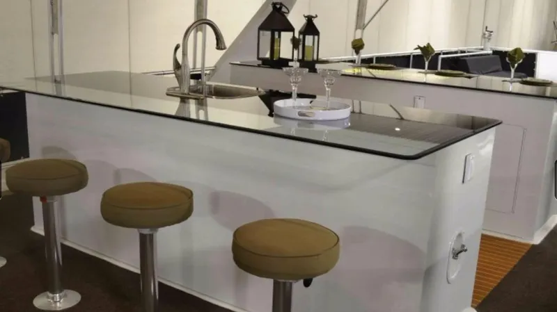 Slide: The Image of Modern kitchen island with bar stools in a 2012 Bravada Ho'okipa Trip 13. - 10