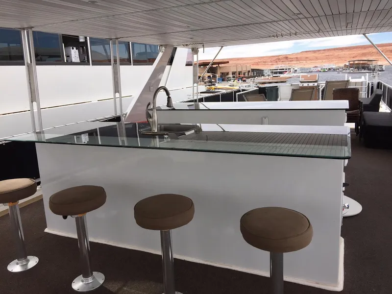 Slide: The Image of Luxurious Bravada Ho'okipa Trip 13 yacht bar area with stools and sink, 2012 model. - 11