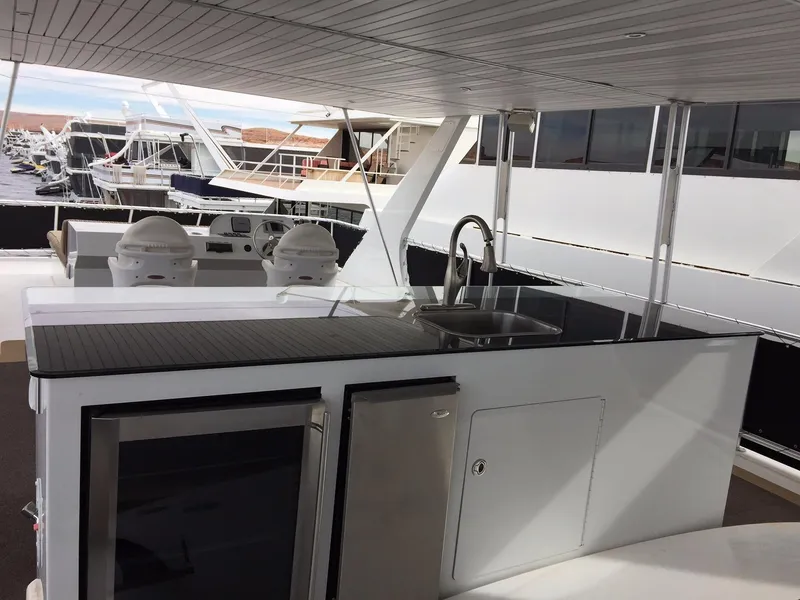 Slide: The Image of Modern outdoor kitchen on 2012 Bravada Ho'okipa Trip 13 yacht, featuring sleek countertops and appliances. - 12
