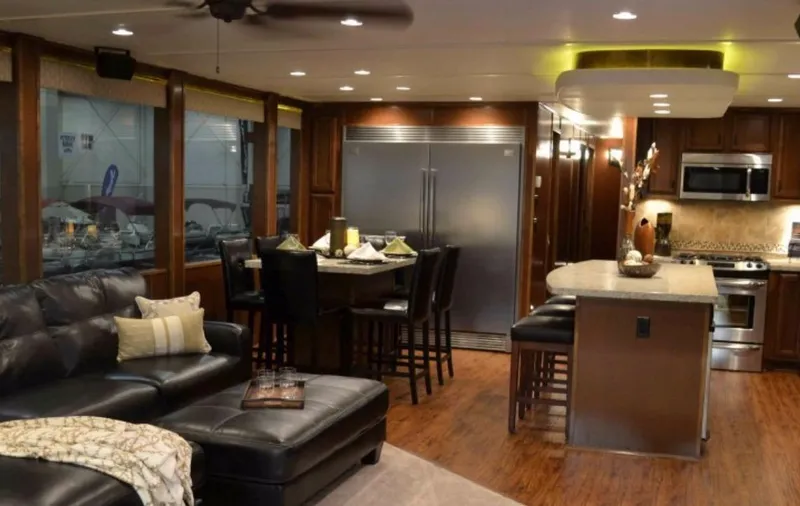 Slide: The Image of Luxurious interior of 2012 Bravada Ho'okipa Trip 13 houseboat with modern kitchen and seating area. - 2