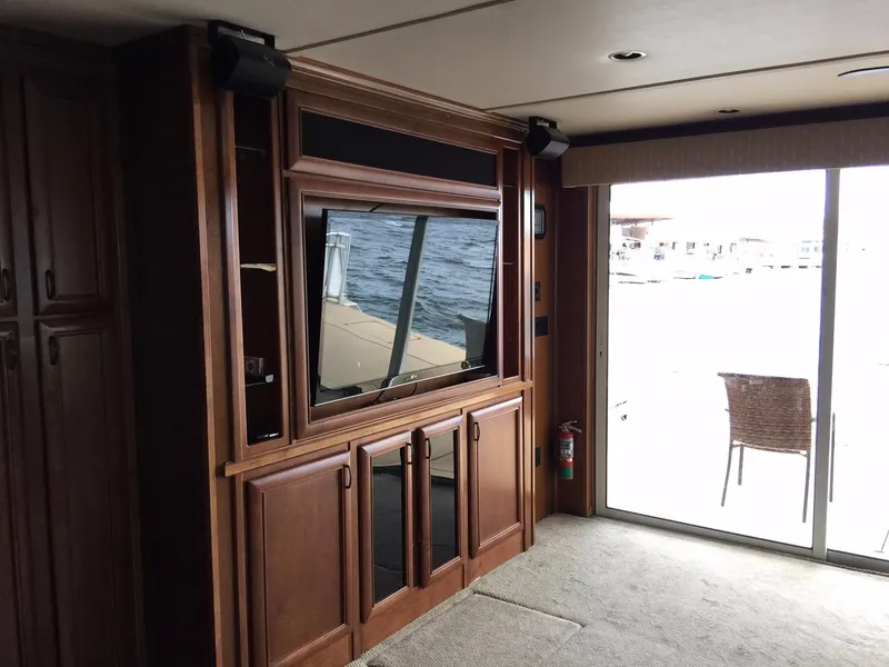 Slide: The Image of Luxurious interior of 2012 Bravada Ho'okipa Trip 13 houseboat with wood cabinetry and large window. - 7