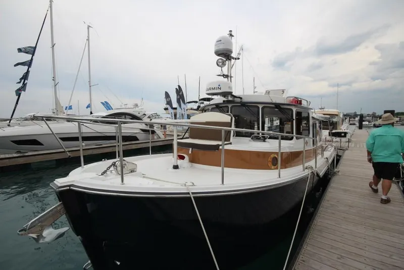 Slide: The Image of 2024 Ranger Tugs R-31 Sedan Luxury Edition docked at marina. - 37