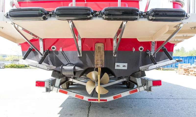 Slide: The Image of 2024 Ranger Tugs R-31 Sedan Luxury Edition boat stern with propeller and trailer. - 17