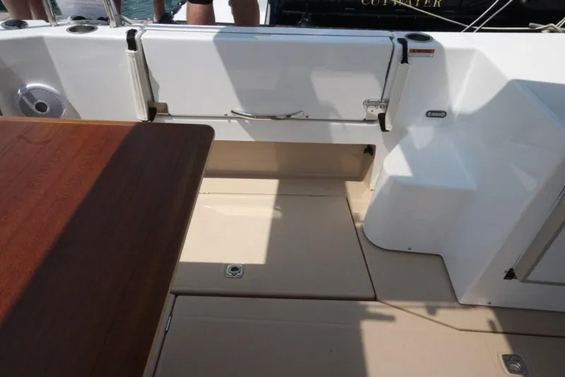 Slide: The Image of 2024 Ranger Tugs R-31 Sedan Luxury Edition boat interior with seating and table. - 45