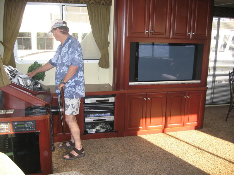 Slide: The Image of Man inside 2004 Skipperliner Dream Chaser Group C, near entertainment center and control panel. - 11