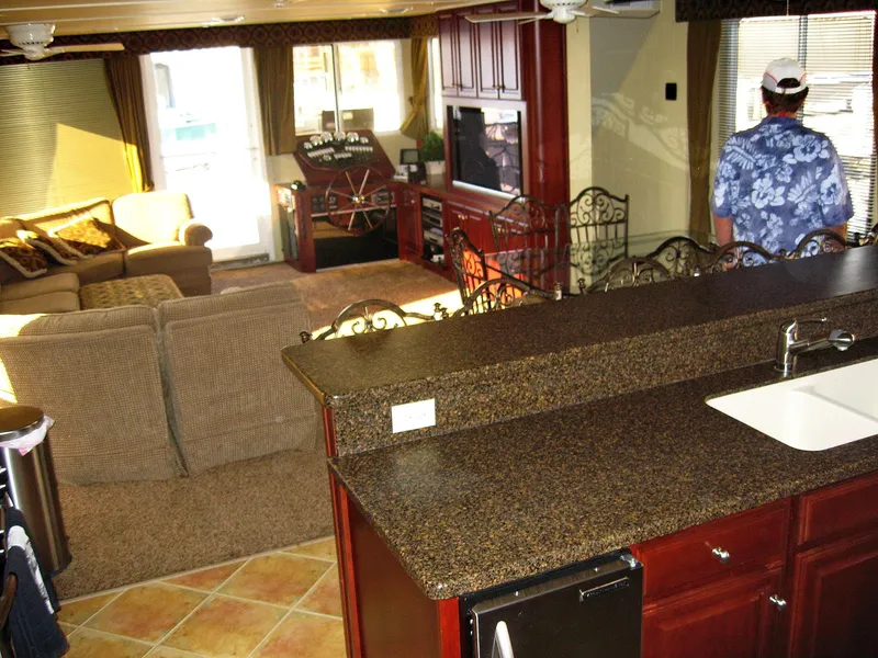 Slide: The Image of Luxurious 2004 Skipperliner Dream Chaser Group C interior with modern kitchen and cozy living area. - 15