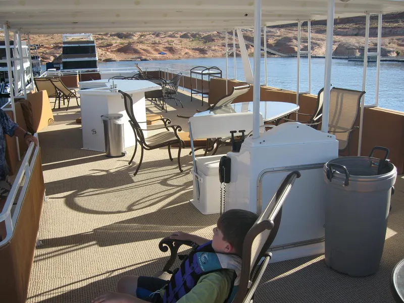 Slide: The Image of 2004 Skipperliner Dream Chaser Group C houseboat deck with seating and lake view. - 6