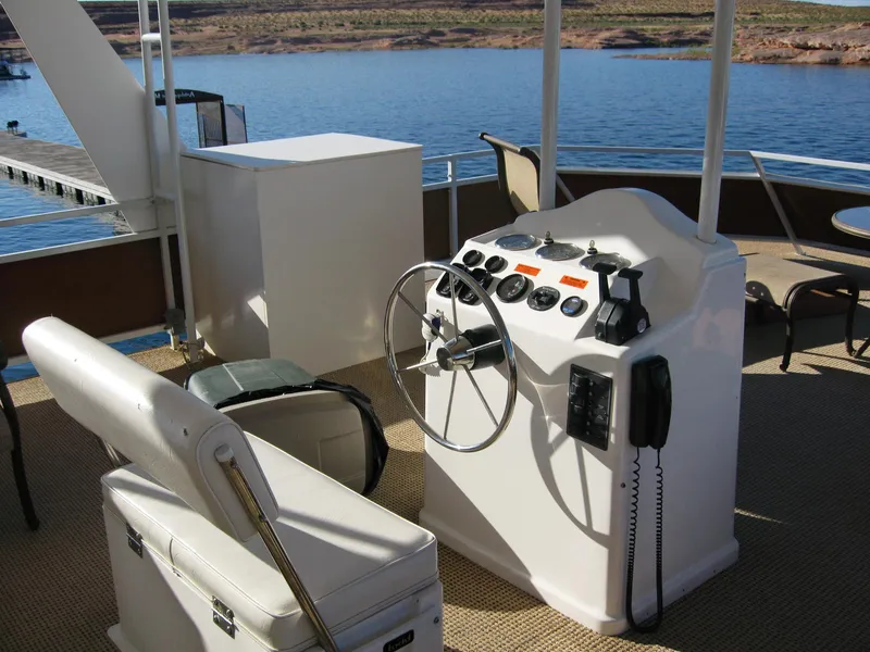 Slide: The Image of 2004 Skipperliner Dream Chaser Group C boat helm with steering wheel and controls. - 7