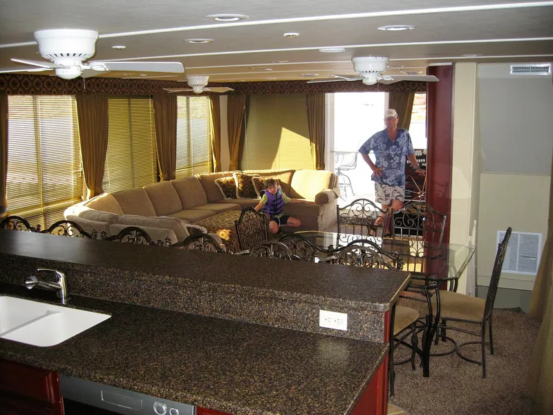 Slide: The Image of Luxurious 2004 Skipperliner Dream Chaser Group C interior with spacious seating and modern kitchen. - 9