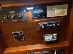 Slide: The Image of 1960 Chris-Craft Roamer control panel with various gauges and electronic devices. - 29
