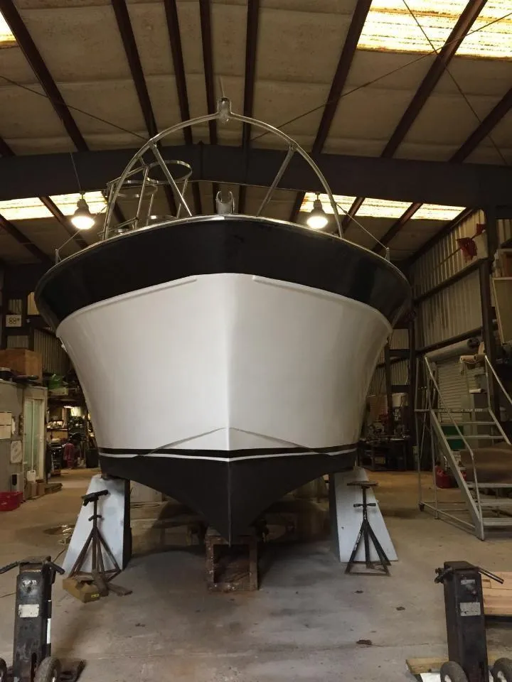 Slide: The Image of 1960 Chris-Craft Roamer boat in a warehouse for maintenance. - 3
