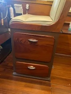 Slide: The Image of 1960 Chris-Craft Roamer interior with wooden drawers and cushioned seat. - 30