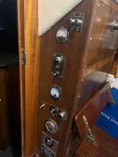 Slide: The Image of 1960 Chris-Craft Roamer boat interior with vintage gauges and wooden paneling. - 31
