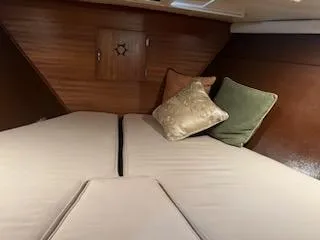 Slide: The Image of Cozy cabin interior of 1960 Chris-Craft Roamer with cushions and wood paneling. - 34