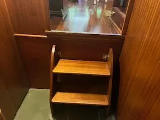 Slide: The Image of Wooden interior stairs on a 1960 Chris-Craft Roamer boat. - 35