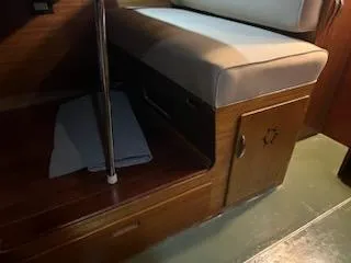 Slide: The Image of 1960 Chris-Craft Roamer interior with wooden cabinetry and cushioned seating. - 37