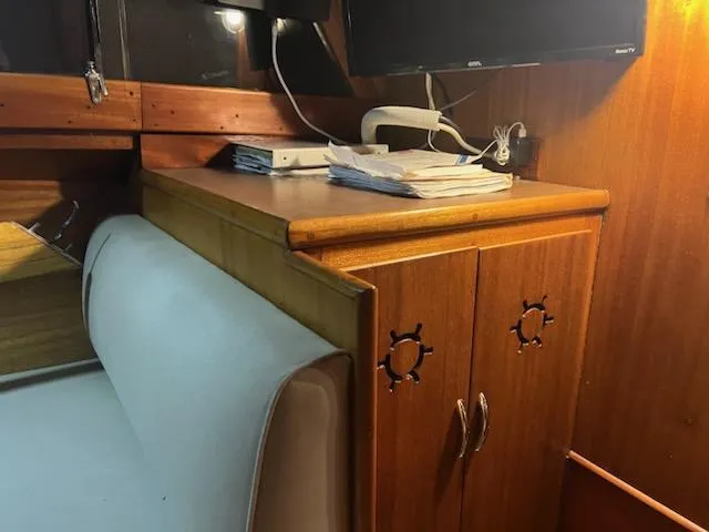 Slide: The Image of 1960 Chris-Craft Roamer interior with wooden cabinetry and seating. - 40