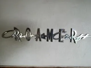 Slide: The Image of Chrome "Roamer" emblem from a 1960 Chris-Craft boat. - 48