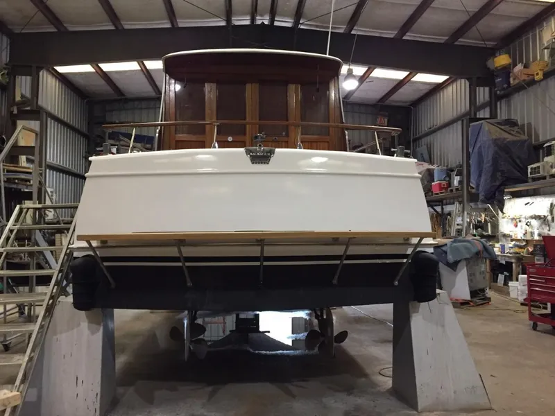 Slide: The Image of 1960 Chris-Craft Roamer boat in a workshop for maintenance. - 6