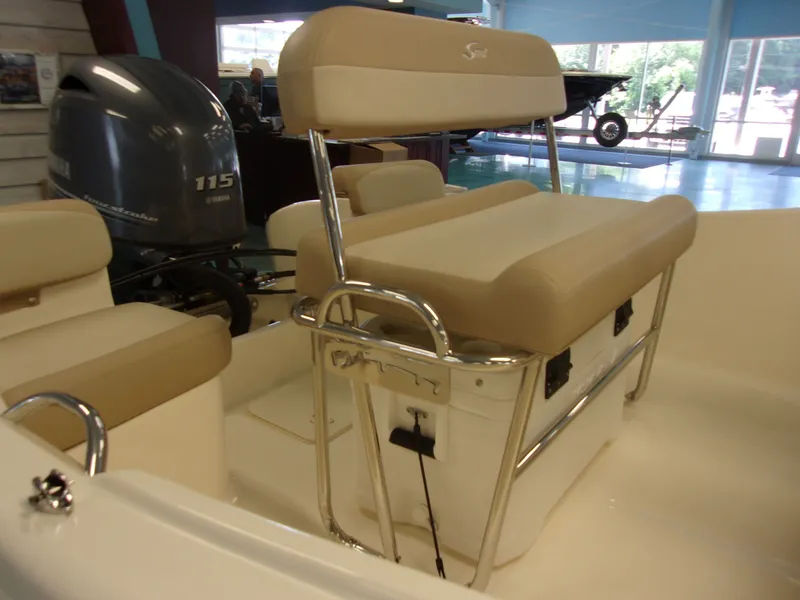 Slide: The Image of Grady-White Freedom 235 boat, 2026 model, featuring engine cover. - 10