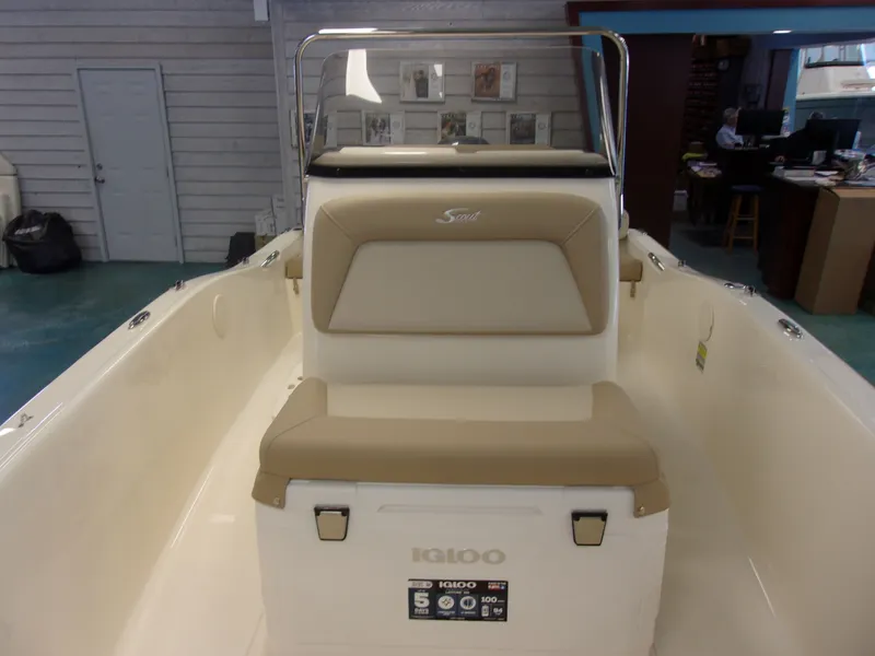 Slide: The Image of 2024 Sportsman Open 232 Center Console boat, interior view with storage compartments. - 11