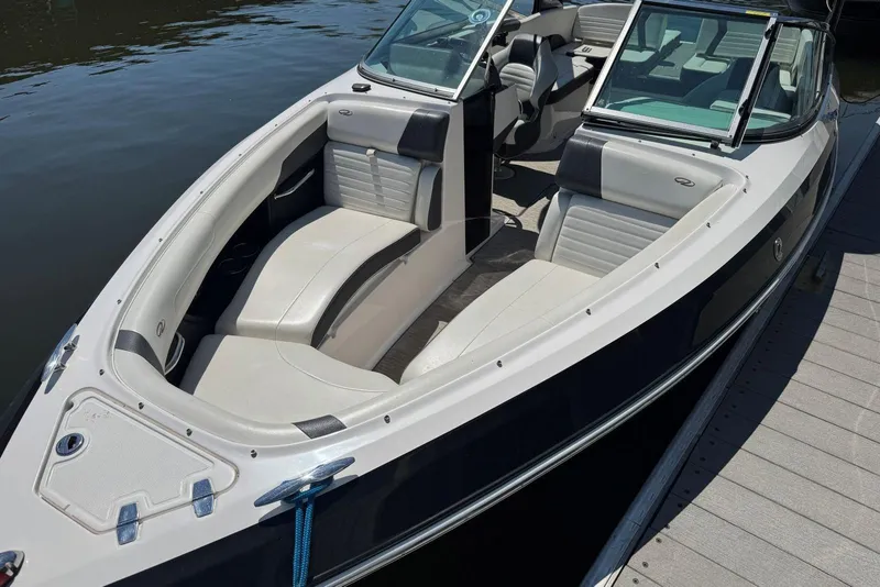 Slide: The Image of 2017 Regal 2500 Bowrider boat docked, featuring spacious seating and sleek design. - 3