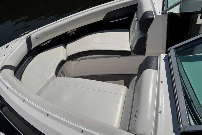 Slide: The Image of 2017 Regal 2500 Bowrider boat interior with white and black seating. - 4