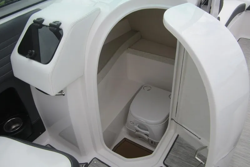 Slide: The Image of 2017 Regal 2500 Bowrider boat interior with compact marine toilet. - 8