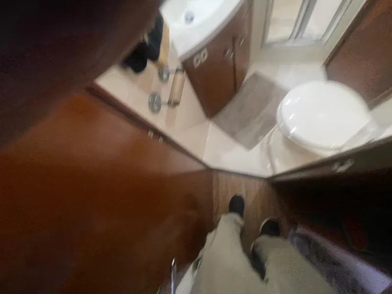 Slide: The Image of Interior of a 1999 Carver Voyager bathroom with sink and toilet. - 23