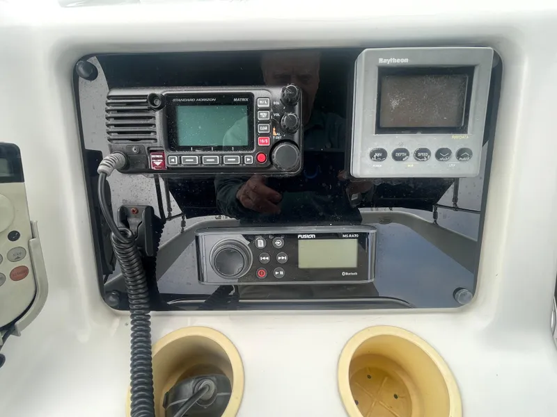 Slide: The Image of Control panel of a 1999 Carver Voyager with navigation and communication equipment. - 33