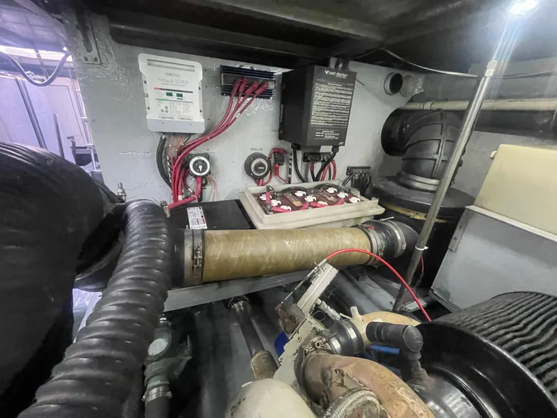 Slide: The Image of Engine room of a 1999 Carver Voyager with visible wiring and components. - 31