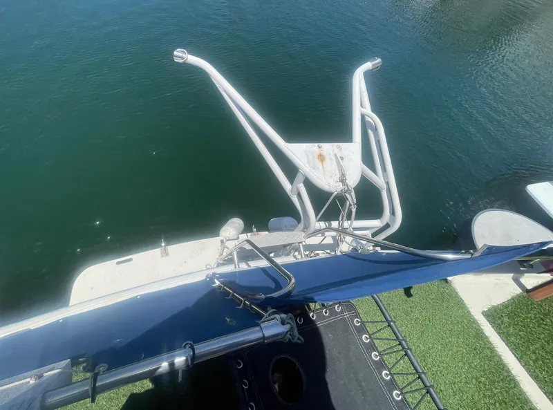 Slide: The Image of 1984 Uniflite Double Cabin Motor Yacht stern view with water and deck details. - 16