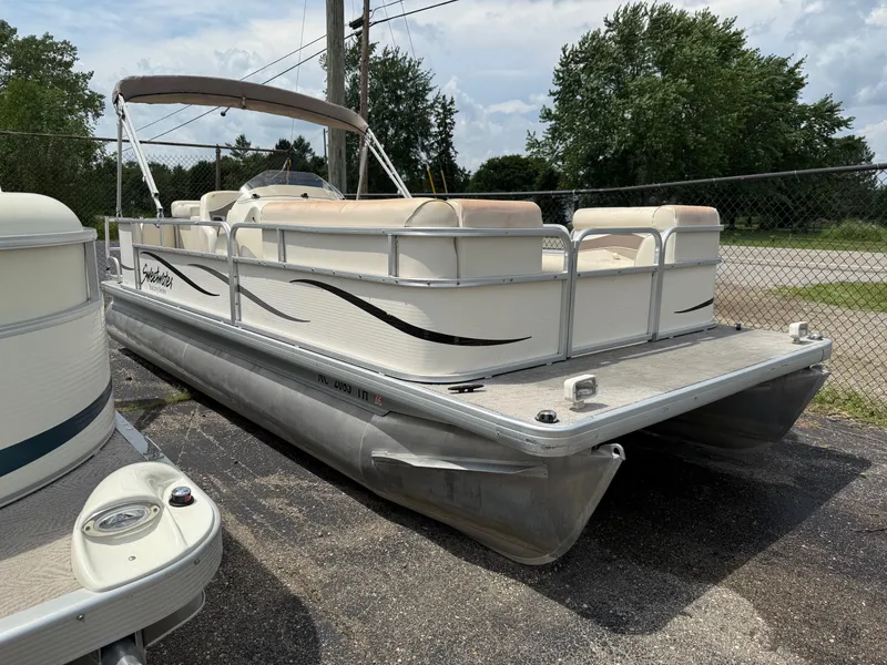 The Image of 2009 Godfrey Tuscany Series pontoon boat in parking lot. - 1