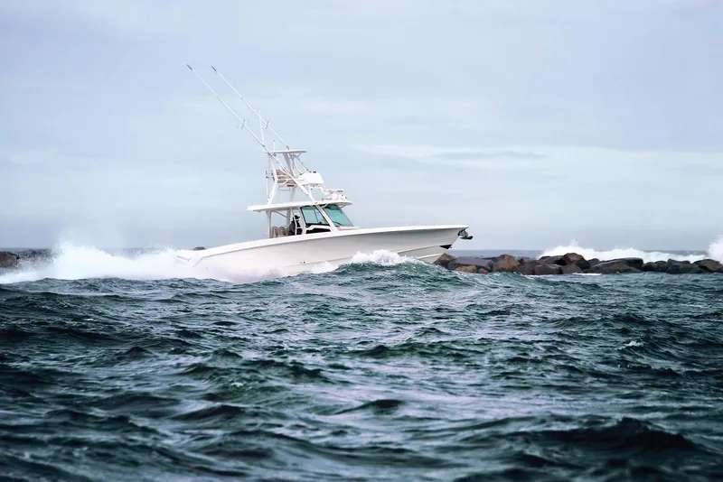 Slide: The Image of 2023 Boston Whaler 380 Outrage navigating rough seas. - 5