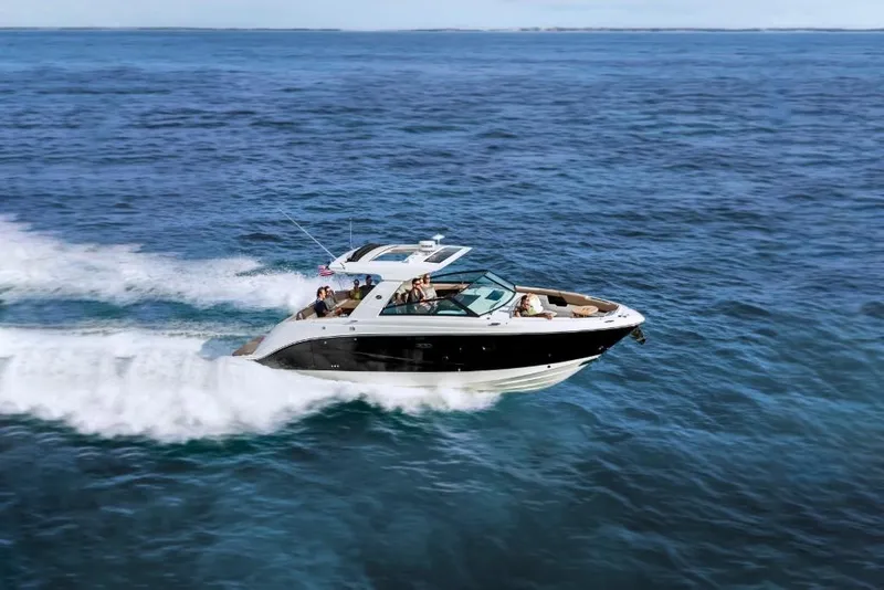 Slide: The Image of 2023 Sea Ray SLX 400 cruising on open water. - 2