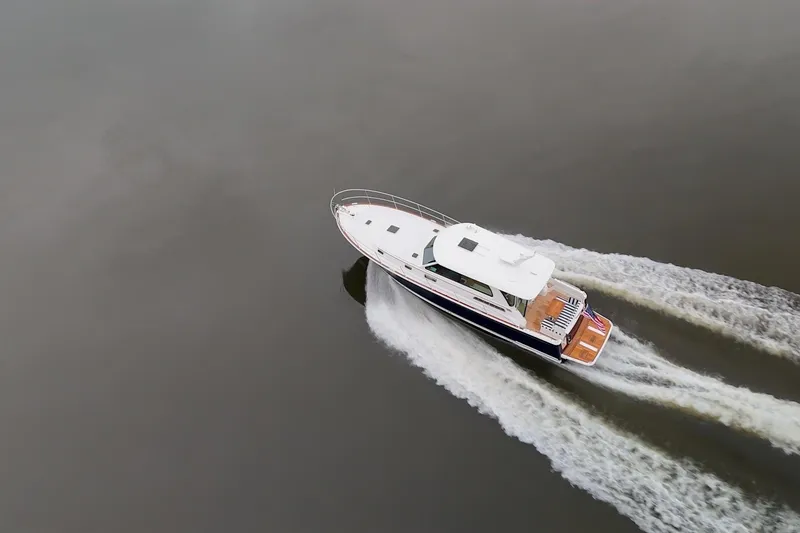 Slide: The Image of Aerial view of 2026 Sabre 45 Salon Express yacht cruising on calm water. - 12