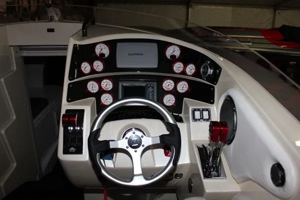 Slide: The Image of Cockpit of 2025 Hustler 39 Rockit boat with Garmin navigation system. - 3