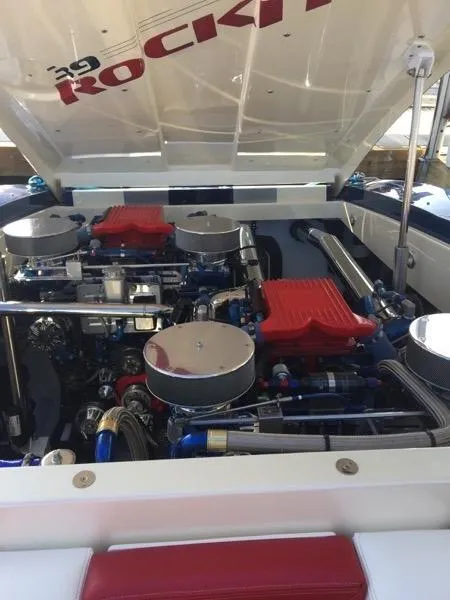 Slide: The Image of 2025 Hustler 39 Rockit boat engine compartment with dual engines. - 7