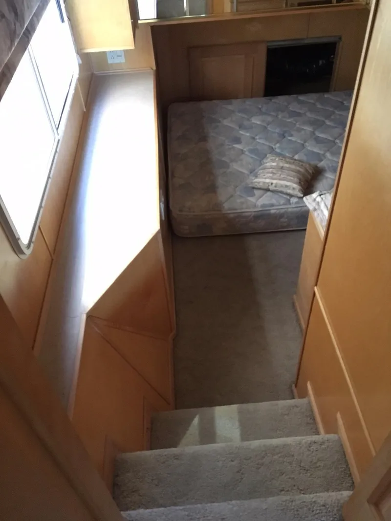 Slide: The Image of Interior of 2002 Sharpe Just Because Week 30 houseboat with stairs and bed. - 14