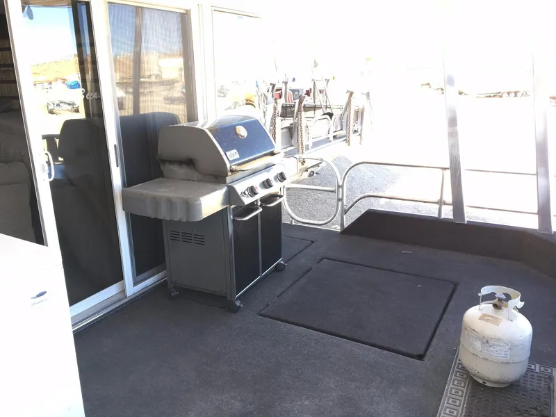 Slide: The Image of Outdoor deck with grill and propane tank on a 2002 Sharpe Just Because Week 30. - 18