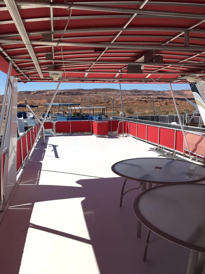 Slide: The Image of Upper deck of 2002 Sharpe Just Because Week 30 houseboat with red canopy and tables. - 20